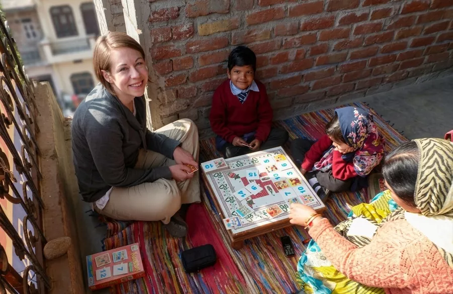 Volunteers greeting local people with Namaste in India