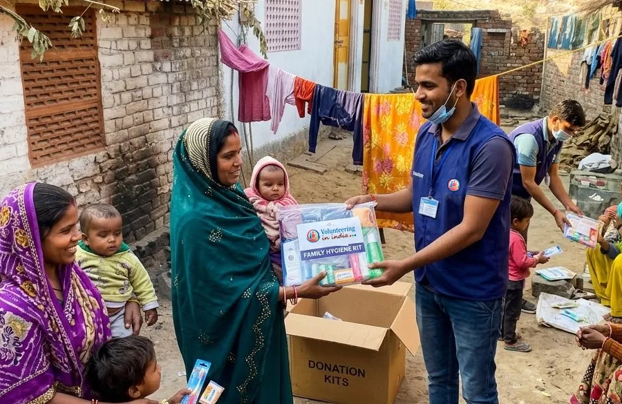 Volunteer distributing hygiene kits to children and families